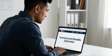Person researching unemployment benefits on laptop for 2026